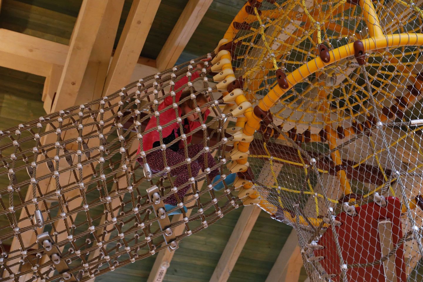 Safety nets are stretched around the custom-made play equipment